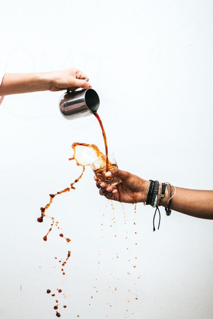 pouring coffe to someone